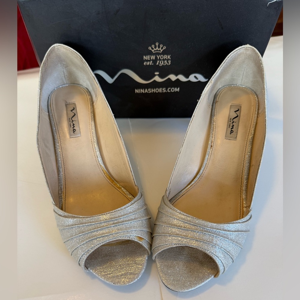 Nina, silver sparkle heels, size 11 wide. One small flaw